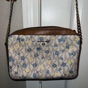 MK cross body bag with blue and yellow flowers